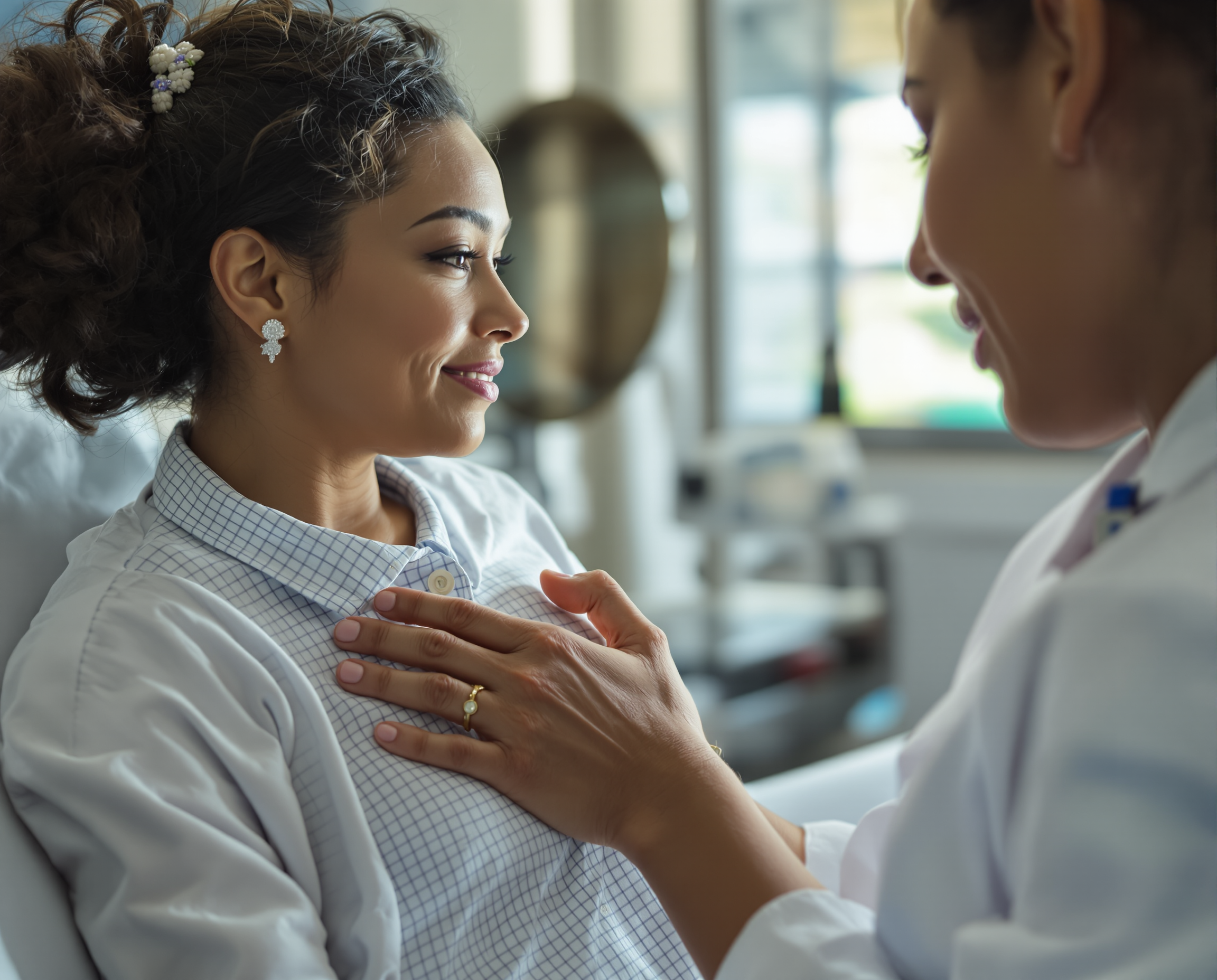 OB-GYN speaking compassionately with a patient